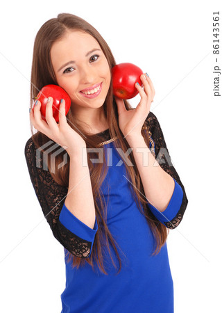 Young girl holds near the face apples 86143561
