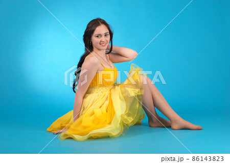Young girl in ballroom dress 86143823
