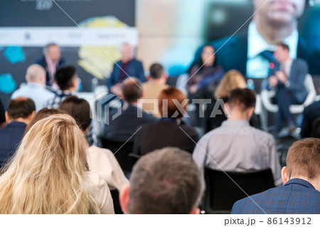 People sitting in conference room 86143912