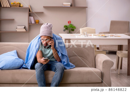 Young man suffering at home Young man suffering at home 86148822