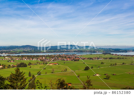 Green fields next to Neuschwanstein Green fields next to Neuschwanstein 86152380