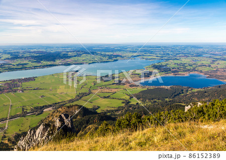 Green fields next to Neuschwanstein Green fields next to Neuschwanstein 86152389