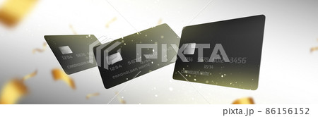Black plastic credit cards and gold ribbons 86156152
