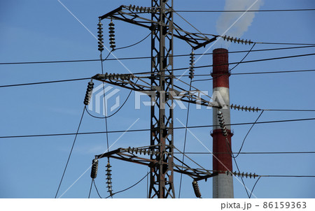 electric pylon and  pipes of coal  burning power station 86159363