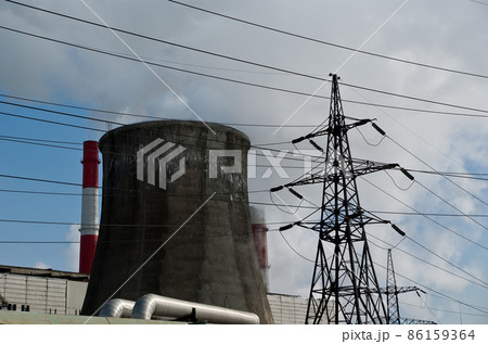 electric pylon and  pipes of coal  burning power station 86159364