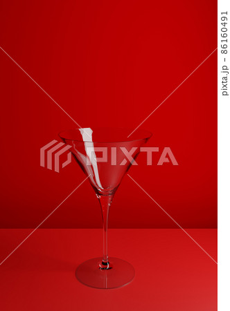 Empty Luxury Cocktail Glass on Red Beautiful Background. Rendering from 3D. 86160491