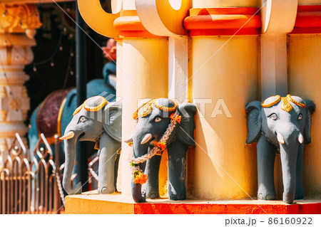 Mapusa, Goa, India. Elephant Statue Near The Shree Ganesh Mandir, Ganeshpuri Temple. Famous Landmark And Popular Destination Mapusa, Goa, India. Elephant Statue Near The Shree Ganesh Mandir, Ganeshpuri Temple. Famous Landmark And Popular Destination 86160922