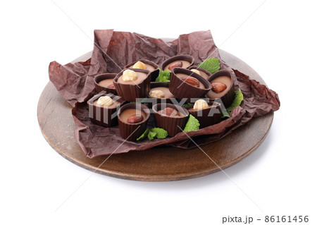 Concept of sweets with chocolate candies isolated on white background 86161456