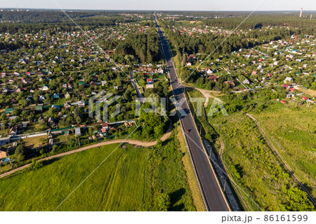 Aerial view of a highway passing through the countryside. Varshavskoye highway near the village of Obolenskoe, Kaluzhskiy region, Russia 86161599
