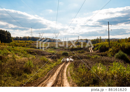 Dirt country road under power line Dirt country road under power line 86161620