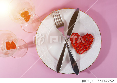 Valentine's day romantic dinner with red hearts on pink background. 86162752