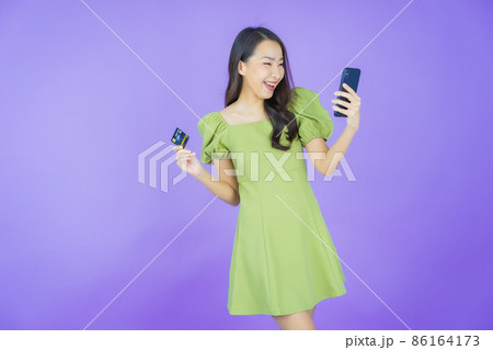 Portrait beautiful young asian woman smile with credit card Portrait beautiful young asian woman smile with credit card 86164173