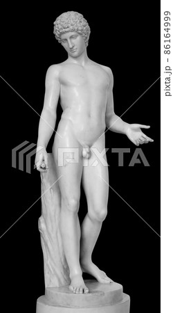 Ancient white marble full length sculpture of naked young man. Antique classic statue of youngster isolated on black. Stone figure of teenager 86164999