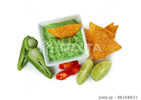 Tasty concept with chips and guacamole isolated on white background 86168031