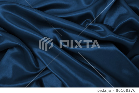 Smooth elegant blue silk or satin luxury cloth texture as abstract background. Luxurious Christmas background or New Year background design Smooth elegant blue silk or satin luxury cloth texture as abstract background. Luxurious Christmas background or New Year background design 86168376