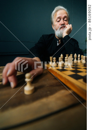 Man Playing Chess Against Himself Shot In The Studio Stock Photo, Picture  and Royalty Free Image. Image 30682890.