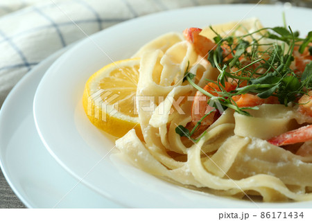 Delicious pasta with tasty shrimps, close up 86171434