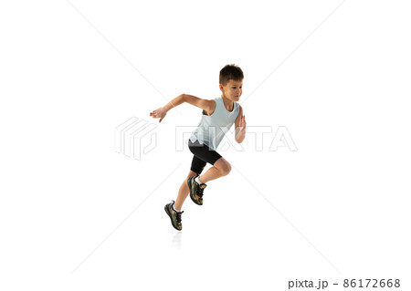 Side view studio portrait of boy, teenager in motion, running isolated over white background Side view studio portrait of boy, teenager in motion, running isolated over white background 86172668