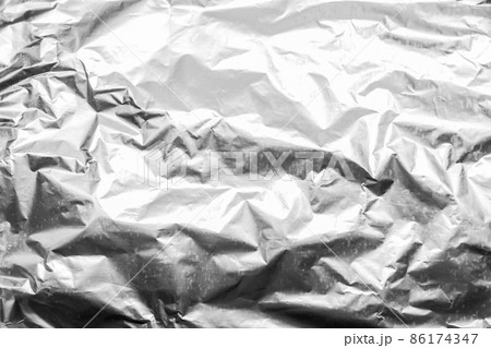 Foil crumpled texture wrinkled silver material abstract pattern surface background 86174347