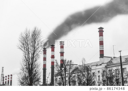 Pollution of the environment, air and ecology are global problems. Toxic smoke from the dirty chimney of an industrial plant is released into the atmosphere 86174348