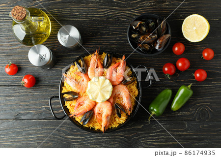 Concept of delicious food with Spanish Paella Concept of delicious food with Spanish Paella 86174935