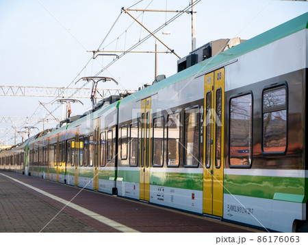 A new electric train at the station A new electric train at the station 86176063
