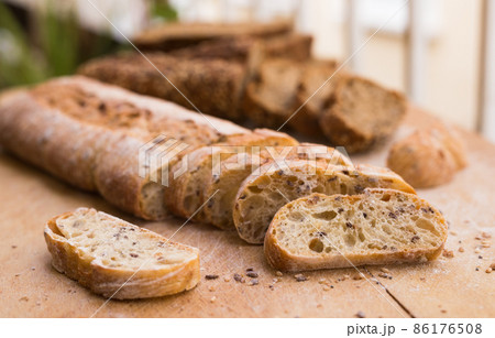 fresh loaf of bread on wooden board fresh loaf of bread on wooden board 86176508