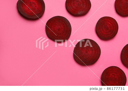 Chopped ripe red beet on pink background Chopped ripe red beet on pink background 86177731