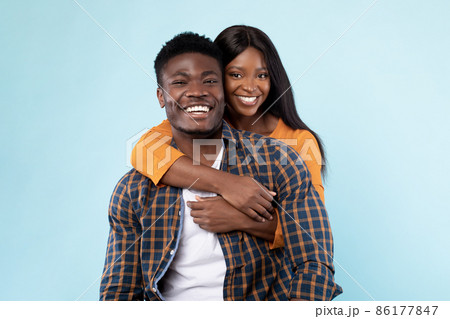 African American lady cuddling with her man 86177847