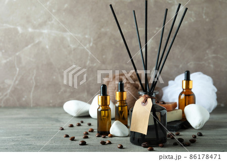 Aromatic concept with diffuser on gray textured table Aromatic concept with diffuser on gray textured table 86178471