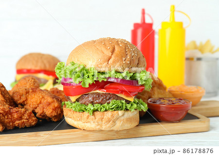 Concept of fast food on white wooden table Concept of fast food on white wooden table 86178876