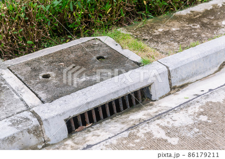 Sewer Drain along Road. 86179211