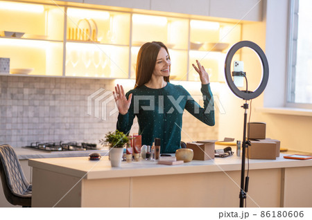 Smiling young beauty coach preparing for going live 86180606