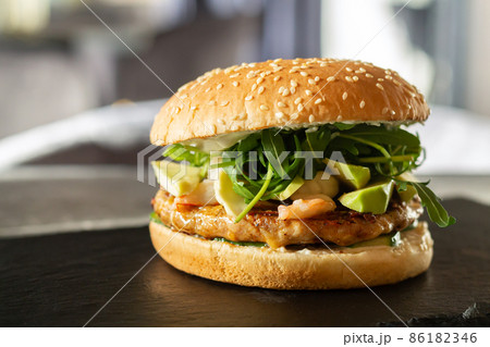 Chicken burger on fast food restaurant table 86182346