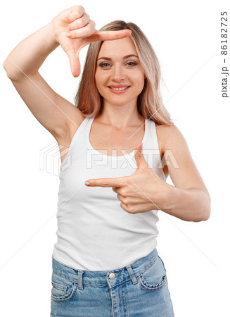 Close up of happy young girl showing frame with fingers isolated on white 86182725