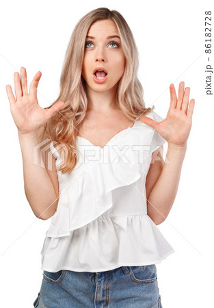 Surprised young woman shouting over white isolated background 86182728
