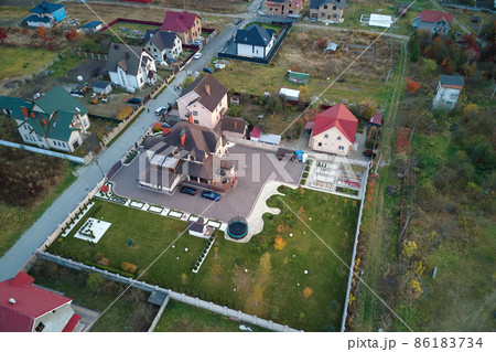 Aerial view of residential houses in suburban rural area Aerial view of residential houses in suburban rural area 86183734