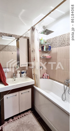 interior of a bathroom with washbasin and bathtub interior of a bathroom with washbasin and bathtub 86184068