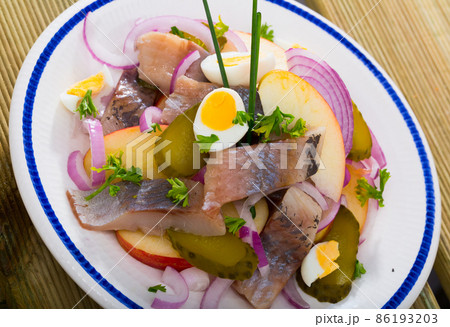 Herring salad with apples and cucumbers Herring salad with apples and cucumbers 86193203