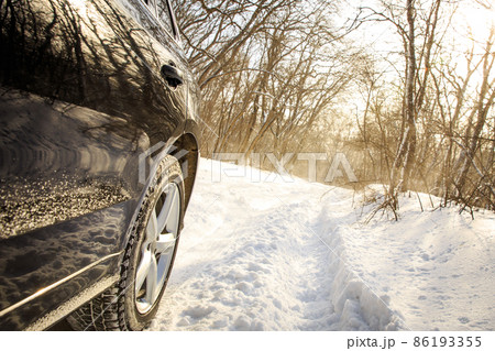 Driving car in winter with much snow Driving car in winter with much snow 86193355