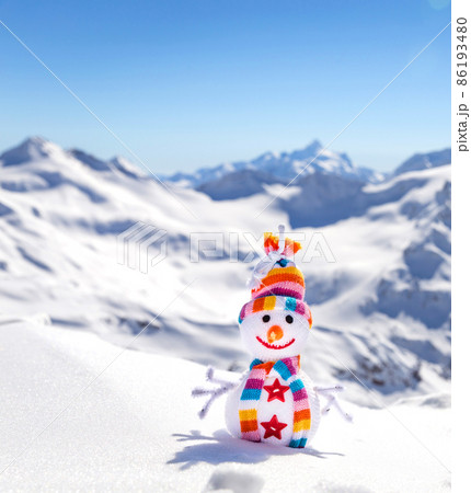 Happy snowman in mountains Happy snowman in mountains 86193480