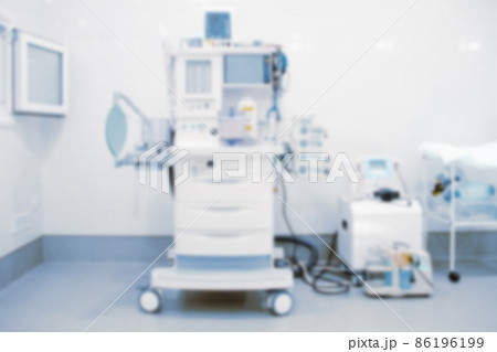 Abstract blur of hospital and clinic interior. Modern equipment in operating room. Medical devices for neurosurgery. Surgery instruments and surgical procedures. Background with blue filter. Abstract blur of hospital and clinic interior. Modern equipment in operating room. Medical devices for neurosurgery. Surgery instruments and surgical procedures. Background with blue filter. 86196199