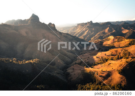 mountains and orange grass in the evening 86200160