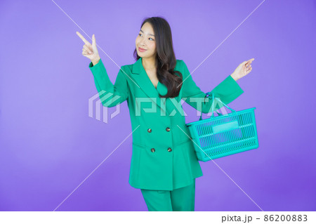 Portrait beautiful young asian woman smile with grocery basket 86200883