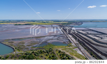 Tailing dump in industrial city aerial view Tailing dump in industrial city aerial view 86202844