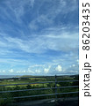 奄美　動きのある雲　青空　ガードレール 86203435
