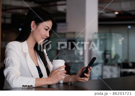 A businesswoman completes KYC using an online banking program in order to open a digital savings account. The definition of cyber security A businesswoman completes KYC using an online banking program in order to open a digital savings account. The definition of cyber security 86203721