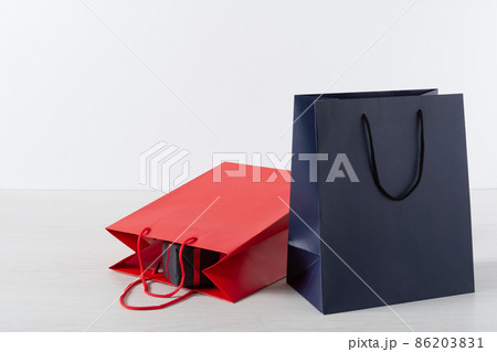 Group of colorful paper shopping bags over white background. 86203831