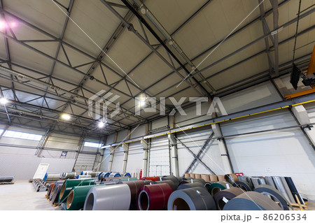 Photo shot of rolls of steel sheet stored in warehouse; Cold rolled steel coils at the factory Photo shot of rolls of steel sheet stored in warehouse; Cold rolled steel coils at the factory 86206534