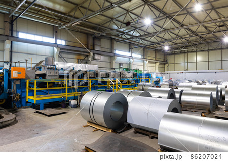Photo of steel roofing forming machine. Industrial machine for metal sheet roof coils cut. Factory Photo of steel roofing forming machine. Industrial machine for metal sheet roof coils cut. Factory 86207024
